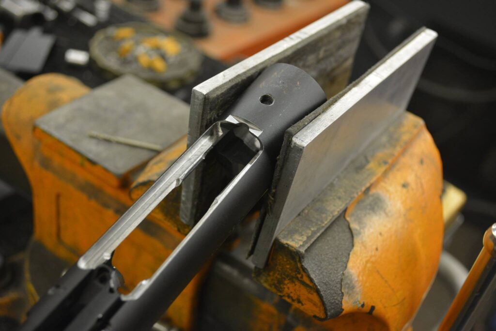 GUNSMITHING SERVICES: AIAW magazine well modification to Rem M700 receiver
